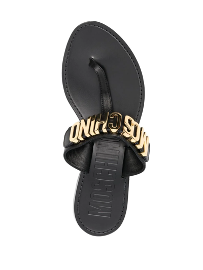 Shop Moschino Logo-plaque Flat Sandals In Black