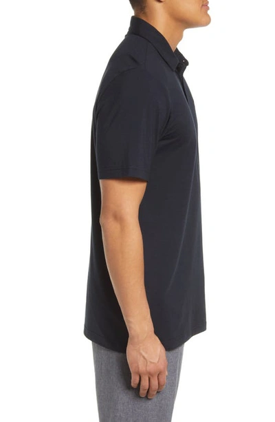 Travismathew The Heater Solid Short Sleeve Performance Polo In Black