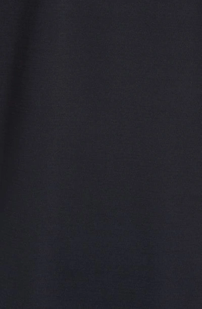 Travismathew The Heater Solid Short Sleeve Performance Polo In Black