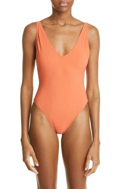 Shop Totême Deep V-neck One-piece Swimsuit In Burnt Orange