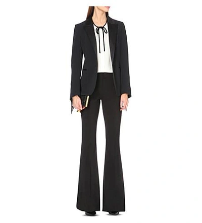 Shop Tom Ford Flared Stretch-wool Trousers In Black