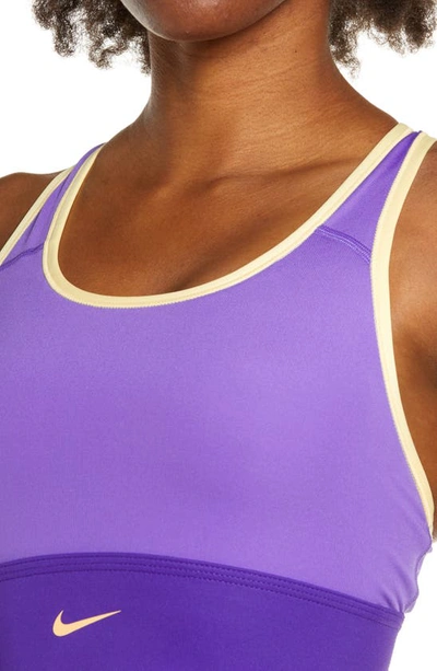 Shop Nike Dri-fit Swoosh Padded Longline Sports Bra In Psychic Purple/melon Tint