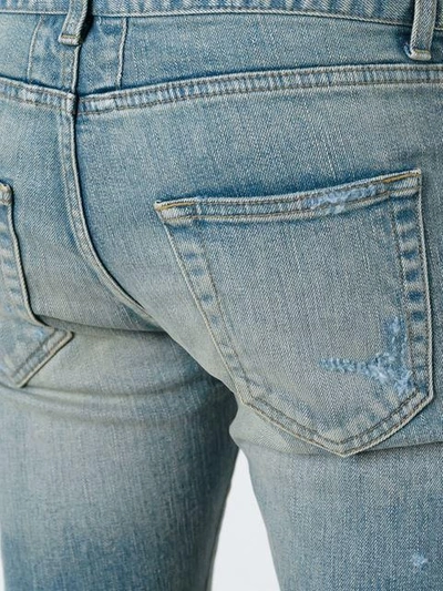 Shop Saint Laurent Distressed Slim Fit Jeans In Blue