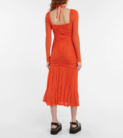 Shop Ganni Textured Ruched Jersey Midi Dress In Orangedotcom