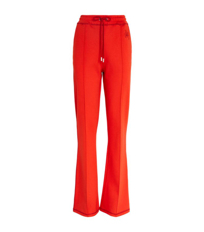 Shop Jw Anderson Flared Track Pants In Red