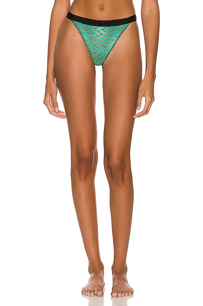 Shop Versace Tulle Monogram Thong In Turquoise
