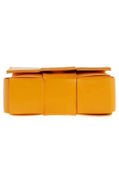 Shop Bottega Veneta Mini Cassette Intrecciato Leather Crossbody Bag In Tangerine-gold