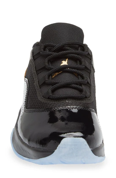 Shop Nike Air Jordan 11 Cmft Low Sneaker In Black/ Metallic Gold