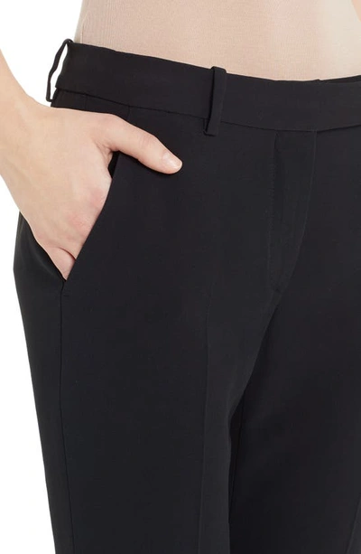 Alexander Mcqueen Tight Bootcut Pants In Black