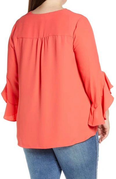 Shop Vince Camuto Flutter Sleeve Crossover Georgette Tunic Top In Radiant Red