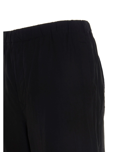 Shop Undercover Loose Trousers In Black