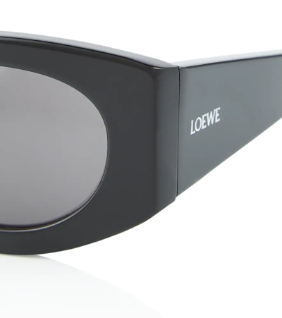 Shop Loewe Nature Oval Sunglasses In Shiny Black / Smoke