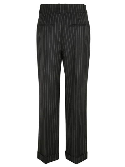 Shop Saint Laurent Flared Cuffs Stripe Trousers In Black