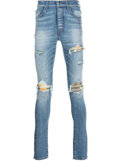 Shop Amiri Distressed Skinny Jeans In Blau