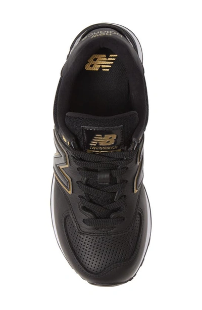 Shop New Balance 574 Sneaker In Black