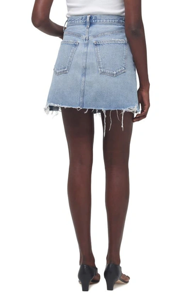 Shop Agolde Crisscross Raw Hem Denim Miniskirt In Symbol