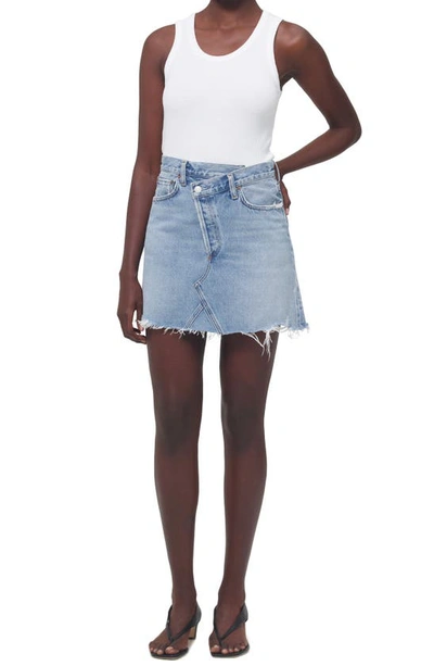 Shop Agolde Crisscross Raw Hem Denim Miniskirt In Symbol