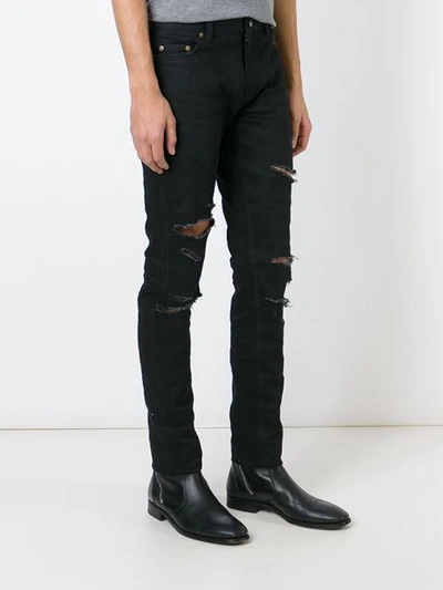 Shop Saint Laurent Skinny Ripped Jeans - Black