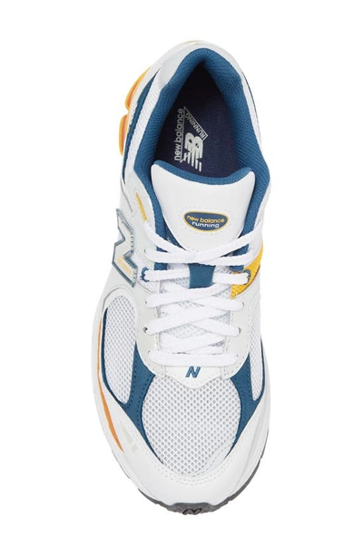 Shop New Balance 2002r Sneaker In White/ Orange