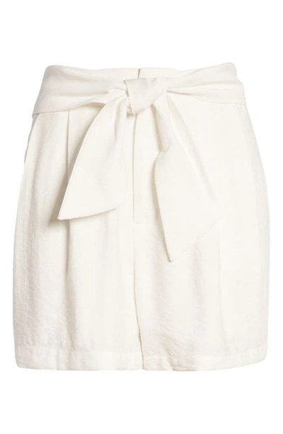 Shop Cece Tie Waist Pleat Shorts In Soft Ecru