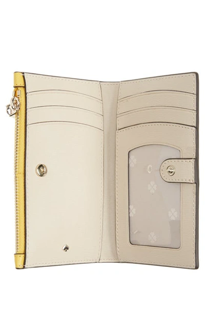 Shop Kate Spade Small Spencer Slim Leather Bifold Wallet In Morning Light