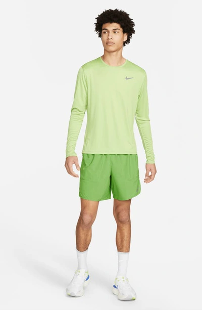 Shop Nike Dri-fit Stride 2-in-1 Running Shorts In Chlorophyll/ Dark Grey/ Green
