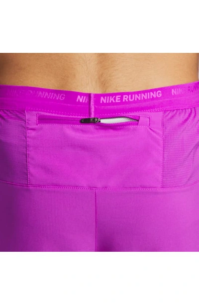 Shop Nike Dri-fit Stride 2-in-1 Running Shorts In Purple/ Royal Blue