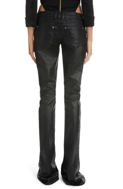 Shop Balmain Coated Low Rise Flare Cuff Bootcut Jeans In Noir