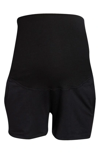 Shop Beyond Yoga Foldover Fleece Maternity Shorts In Black