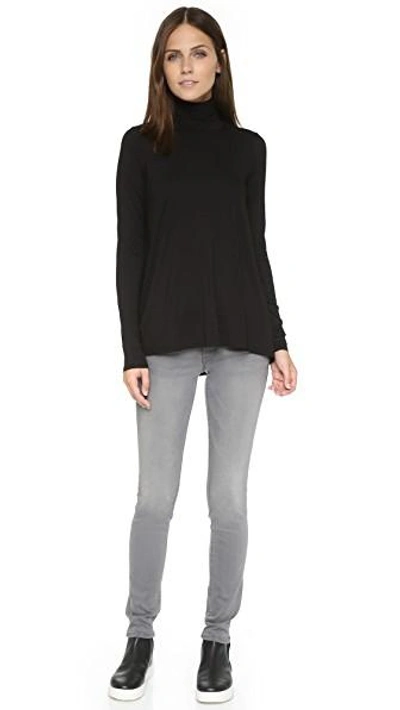 Shop Three Dots Relaxed Hi Lo Turtleneck In Black