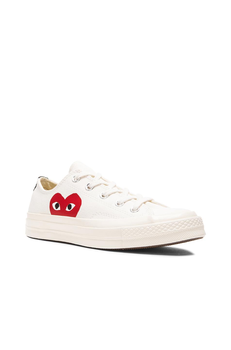 comme des garcons play emblem low top sneaker