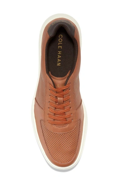 Shop Cole Haan Grand Crosscourt Modern Perforated Sneaker In British Tan Leather/ Ivory