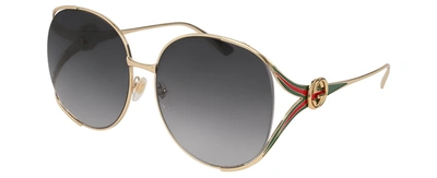 Shop Gucci Gg0225s 001 Oval Sunglasses In Grey