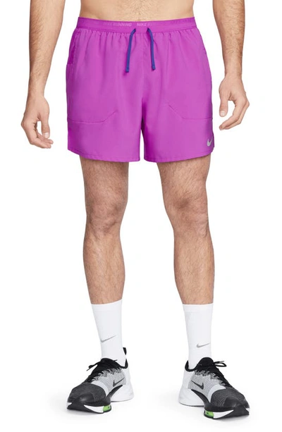 Shop Nike Dri-fit Stride 5-inch Running Shorts In Vivid Purple/ Deep Royal Blue