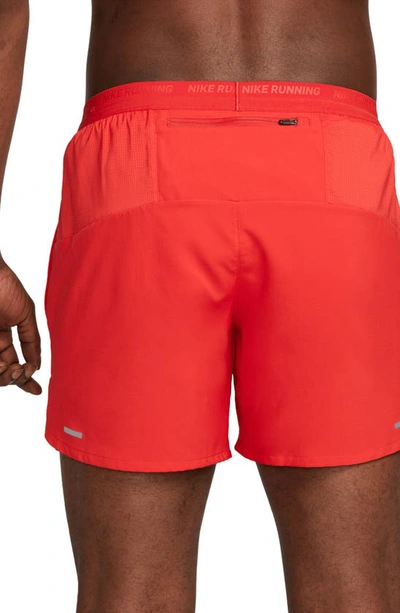 Shop Nike Dri-fit Stride 5-inch Running Shorts In University Red/ Black