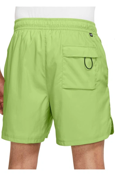 Shop Nike Woven Lined Flow Shorts In Vivid Green/ White