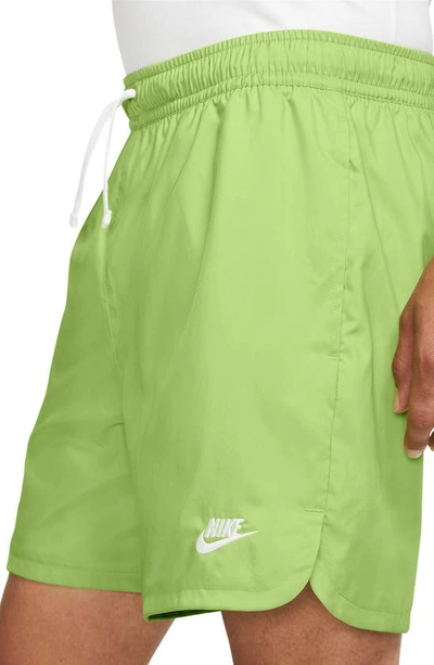 Shop Nike Woven Lined Flow Shorts In Vivid Green/ White