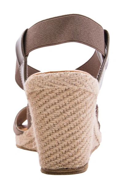 Shop Andre Assous Dalmira Wedge Sandal In Taupe