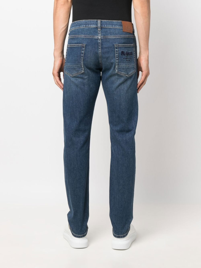 Shop Alexander Mcqueen Embroidered-logo Detail Jeans In Blue