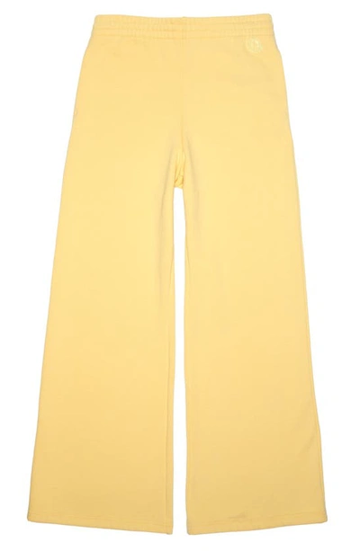 Shop Moncler Wide Leg Cotton Blend Fleece Joggers In Yellow