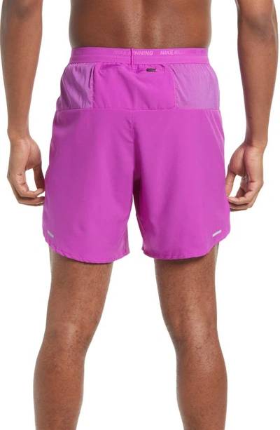 Shop Nike Dri-fit Stride Unlined Running Shorts In Vivid Purple/ Reflective Silv