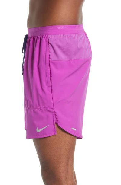 Shop Nike Dri-fit Stride Unlined Running Shorts In Vivid Purple/ Reflective Silv
