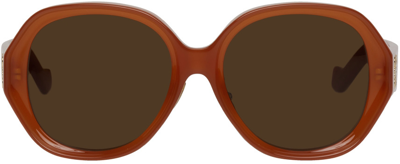Shop Loewe Orange Round Sunglasses In Shiny Orange / Brown