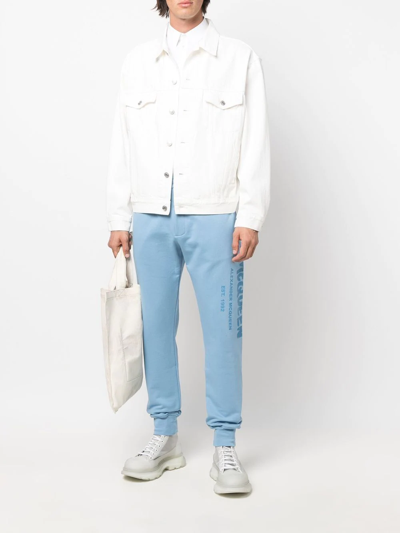 Shop Alexander Mcqueen Logo-print Slip-on Track Pants In Blue