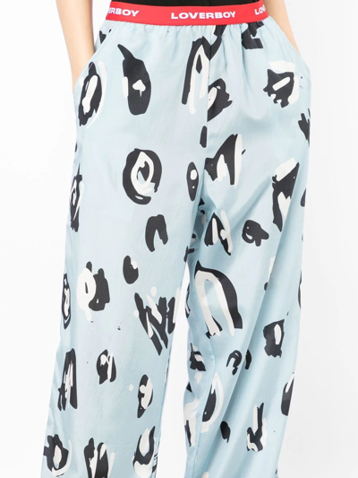 Shop Charles Jeffrey Loverboy Abstract-print Logo-waist Trousers In 蓝色