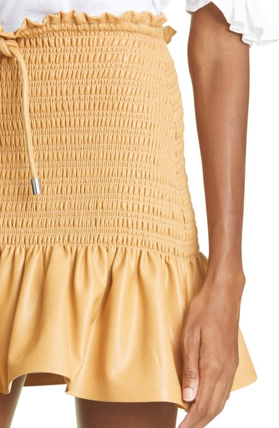 Shop A.l.c Jenny Smocked Ruffle Faux Leather Miniskirt In Petite Grain
