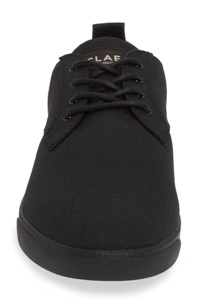 Shop Clae Ellington Sneaker In Black Waxed Canvas Black