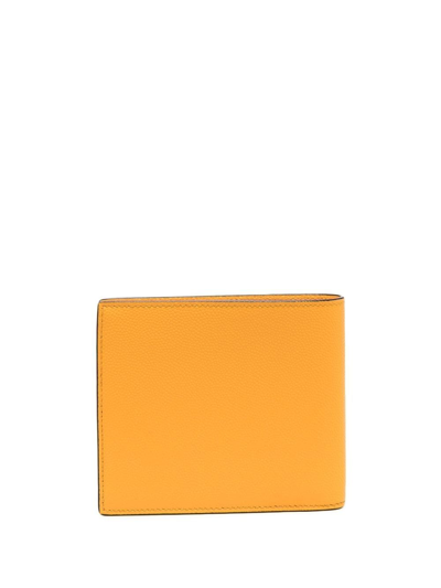 Shop Saint Laurent Bi-fold Leather Wallet In Yellow