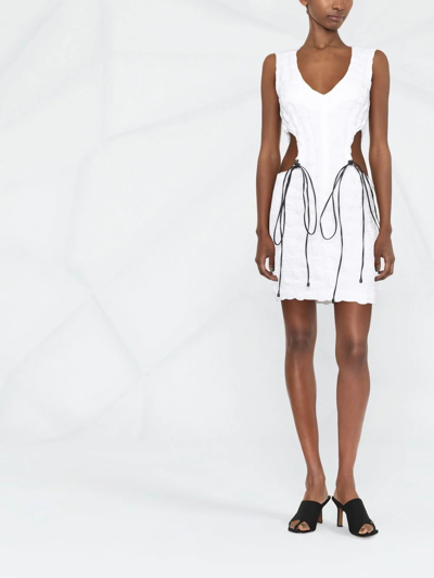 THE MANNEI CUT-OUT DRAWSTRING MINI DRESS 