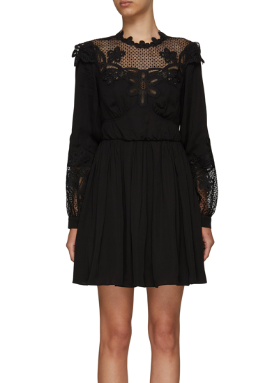 Shop Self-portrait Lace Bib Long Sleeved Mini Dress In Black